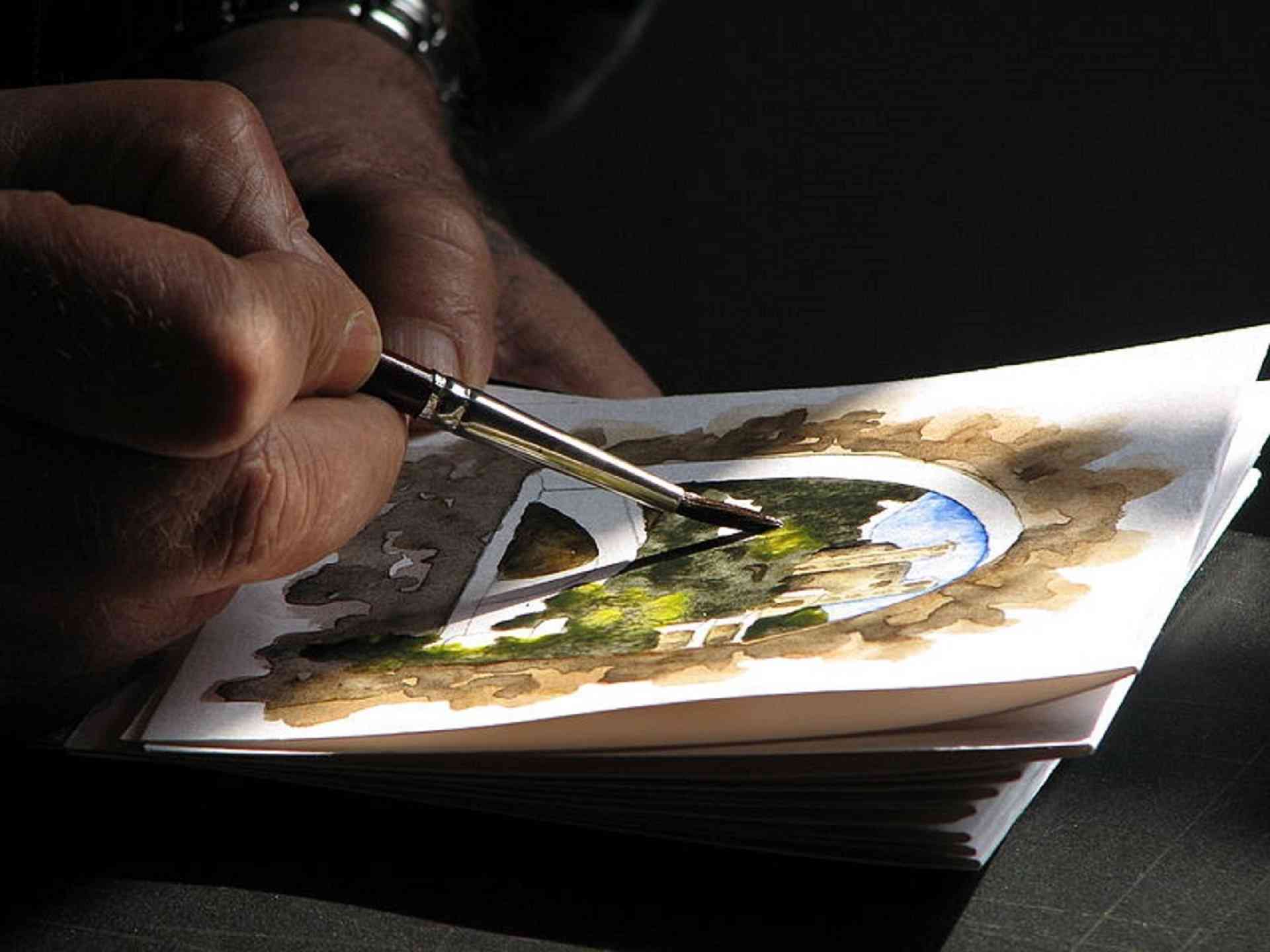 Image: In this photograph, a watercolor painter works in Dolceacqua Liguria, Italy. Watercolor Art Prize